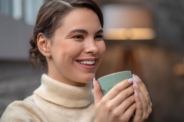 Happy cute lady enjoying her coffee break - Фото, зображення