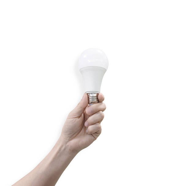 Mannelijke hand met LED-lamp Geïsoleerd op witte achtergrond met knippad. Milieuvriendelijk concept. - Foto, afbeelding