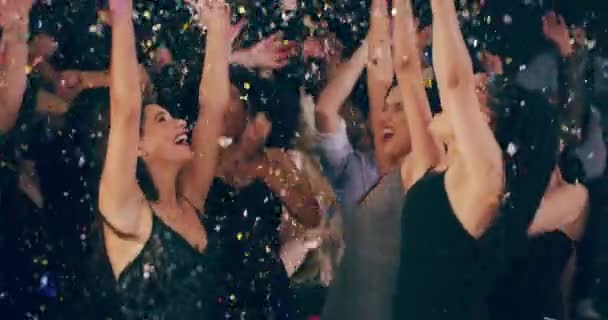 Party night done right. 4k video footage of young women dancing together at a party surrounded by falling confetti. - Кадри, відео