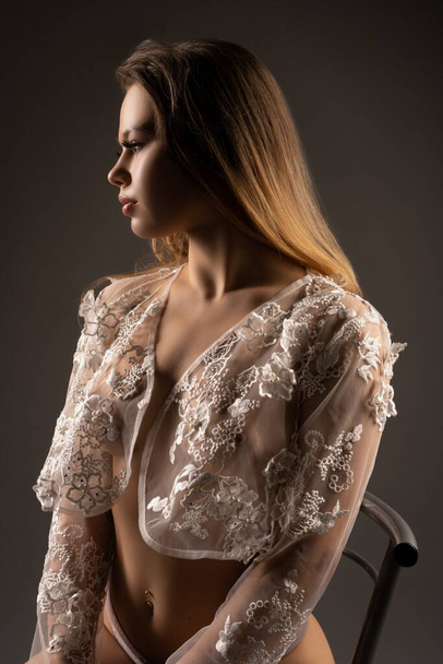 Gorgeous woman in transparent lace wear in studio - Zdjęcie, obraz