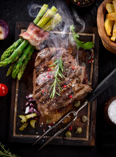 Beef steak on wooden table - Photo, Image