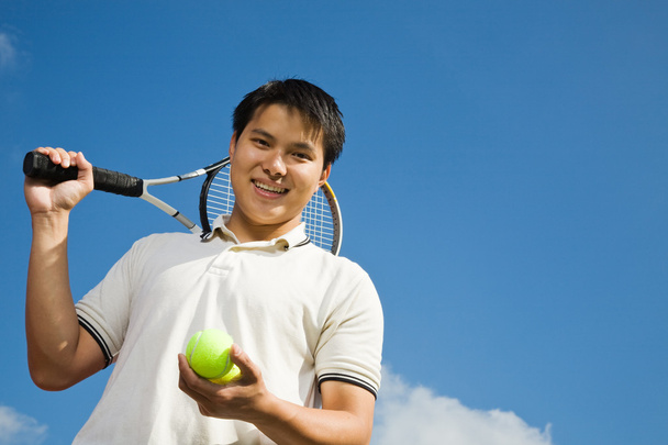 Asian male playing tennis - Photo, Image