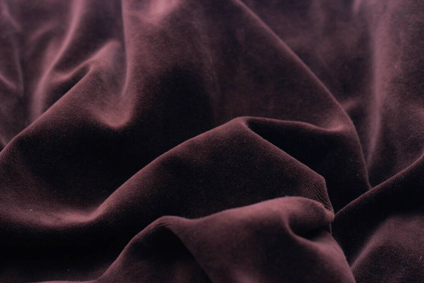 Crimson fabric texture background on the floor. - Photo, image