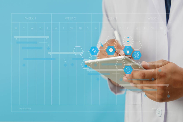 healthcare and medical doctor smart tablet device  doctor analyzing medical report at the hospital background. - Foto, Bild