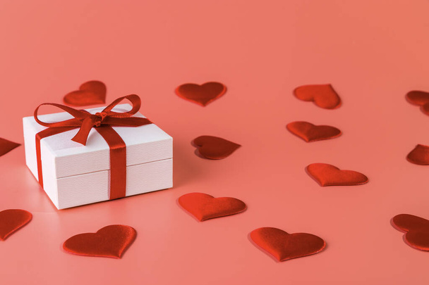 Valentine's day background with red hearts and gift. Copy space.  - Foto, afbeelding