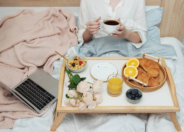 Romantic breakfast with coffee, waffles, orange juice and rose flowers.  - Fotó, kép