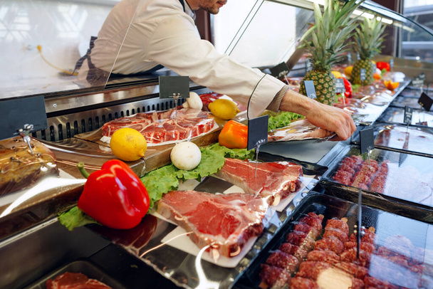 Fresh raw good quality meat on counter in Butcher shop - Fotoğraf, Görsel