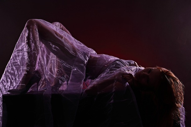 Portrait of very beautiful young sexy woman, under violet veil - Fotó, kép