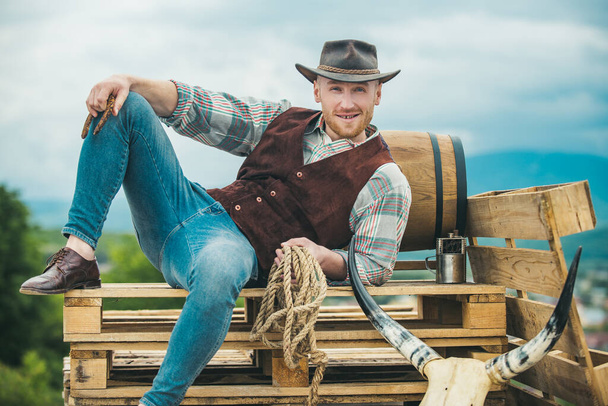 Sexy western man with cowboy hat. Men retro fashion, vintage vogue, brutal male model. - Φωτογραφία, εικόνα