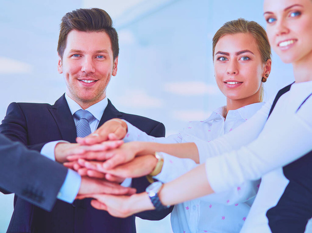 Business people with their hands together in a circle - Fotoğraf, Görsel