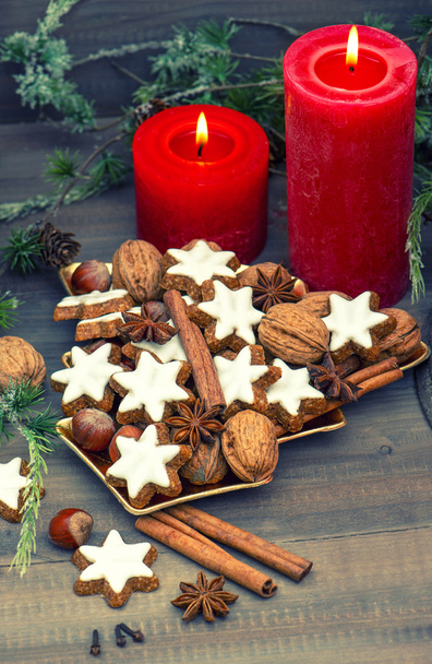 cinnamon cookies, nuts and spices with christmas decoration - Foto, immagini