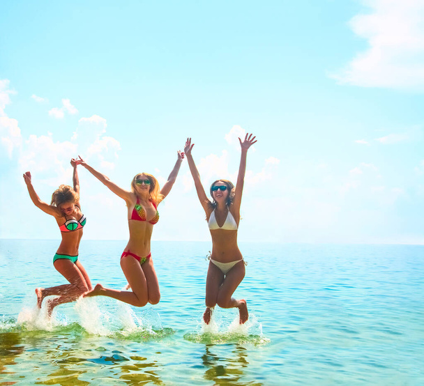 group of happy young women having fun in   water  - Фото, изображение