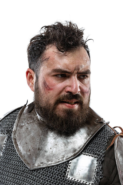 Cropped portrait of brave and brutal medieval warrior or knight isolated over white background - Φωτογραφία, εικόνα