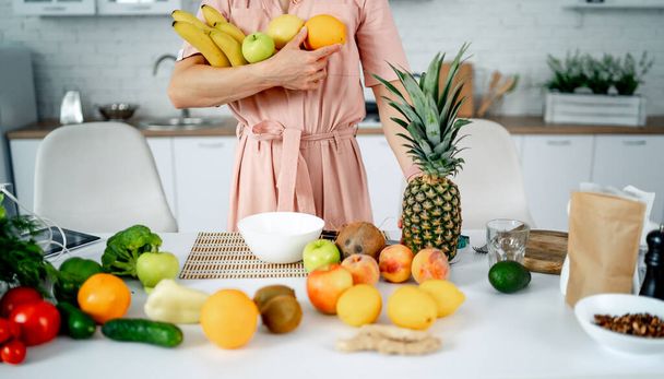 Lifestyle vegeterian organic meal. Vegetables and fruits in woman hands. - Fotó, kép