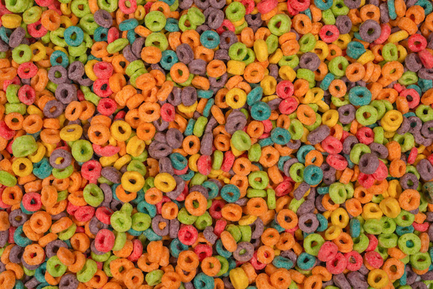 Sweet multicolored flakes, cereal loops as a background..  - Fotó, kép