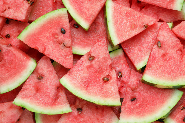 Slices of tasty ripe watermelon as background, top view - Zdjęcie, obraz