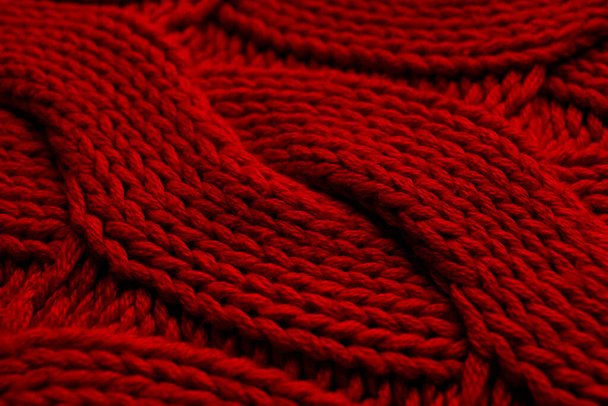 Beautiful red knitted fabric as background, closeup - Zdjęcie, obraz