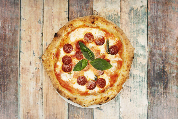 The pepperoni is characteristically mild, slightly smoked, and bright red - Photo, Image