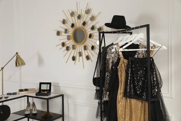 Rack with stylish women's clothes and accessories in dressing room - Φωτογραφία, εικόνα