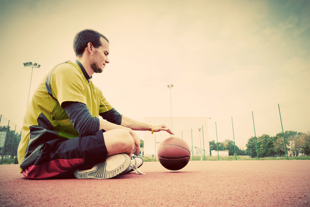 Young man on basketball court. - Photo, Image