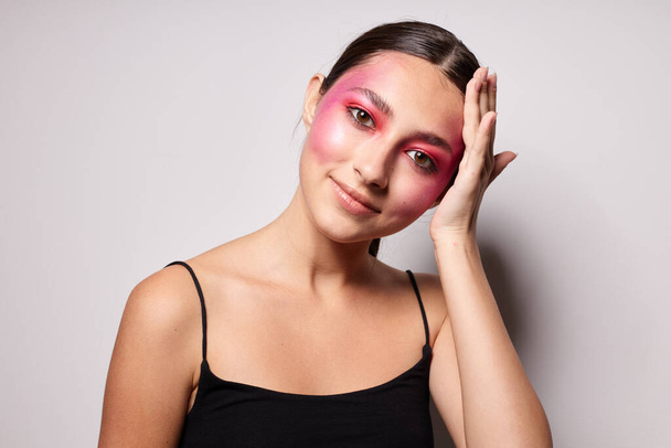 Beauty fashion female smile bright pink makeup emotions cosmetics isolated background unaltered - 写真・画像