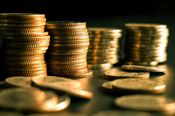 Pile of gold coins stack in finance treasury deposit bank account for saving - Φωτογραφία, εικόνα