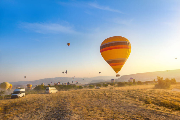 Air balloons flight at sunrise in Cappadocia, Turkey - Photo, Image