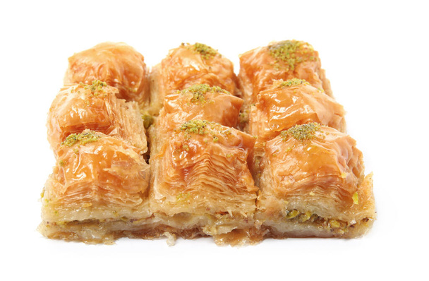 Delicious baklava with pistachios isolated on white - Photo, image
