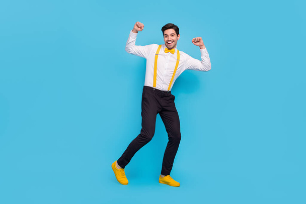Full body portrait of excited funny man enjoy vintage discotheque isolated on blue color background - Foto, imagen