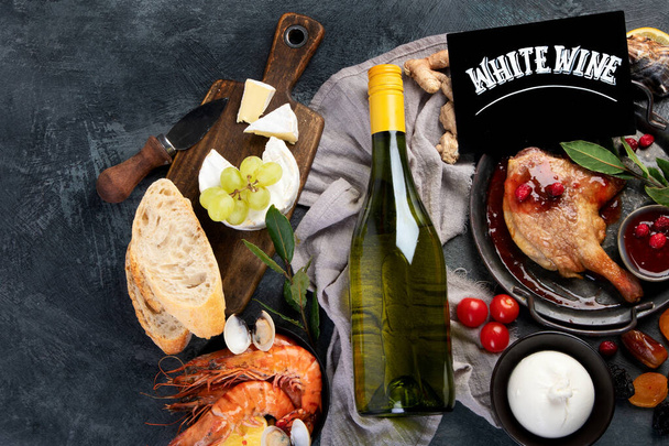 White wine Riesling with duck and snacks. Traditional alcohol drinks. Top view, flat lay, copy space - Фото, зображення