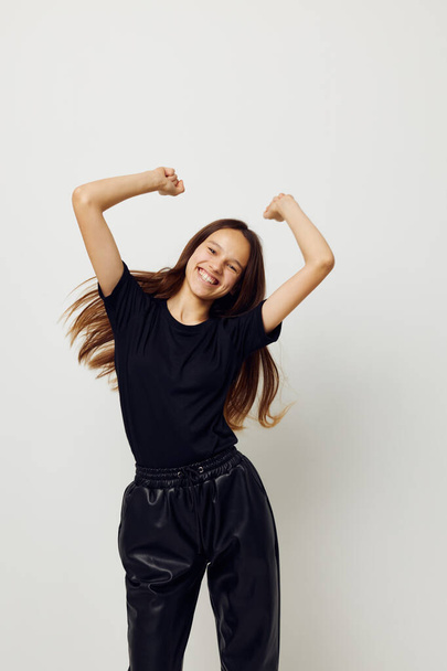 young beautiful woman in a black t-shirt hand gesture fun Lifestyle unaltered - Fotoğraf, Görsel