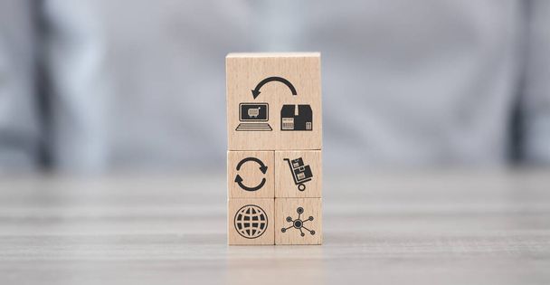 Wooden blocks with symbol of dropshipping concept - Foto, afbeelding