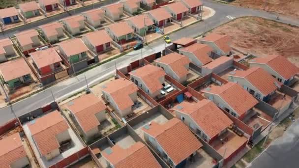 Aerial view of community houses in construction. Panoramic view of popular housing. Suburb popular houses. Community housing construction. Condominium suburban popular neightborhood houses. - Footage, Video