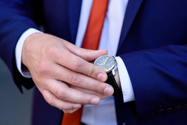 Businessman looks at his watch. - Fotoğraf, Görsel
