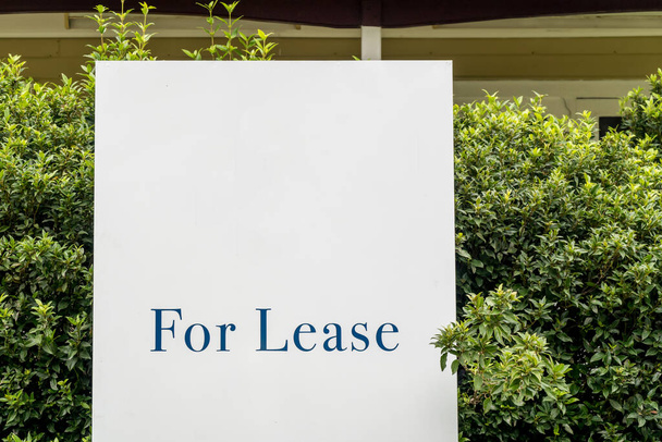 For lease sign on a white display outside of a resedential building house in Australia. Investment property real estate concept - Photo, Image