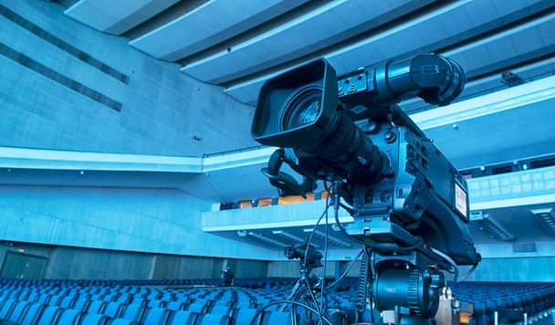 Set up and preparation video camera before the event at stage theater or concert hall for professional photographer filming video or television broadcasts - Photo, Image