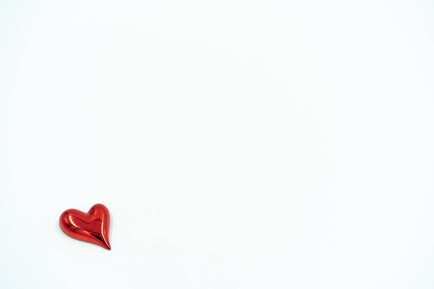 Shiny red heart on white background. Valentin's day concept. Copy space for text. - Foto, Imagen