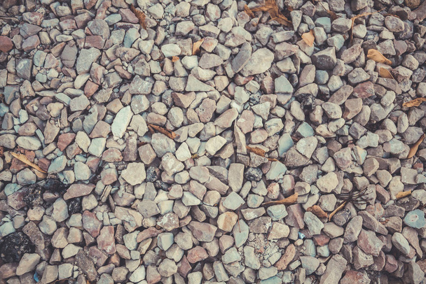 Eine große Anzahl kleiner Steine. Bild von kleinen Trümmern. Harter Stein - Foto, Bild