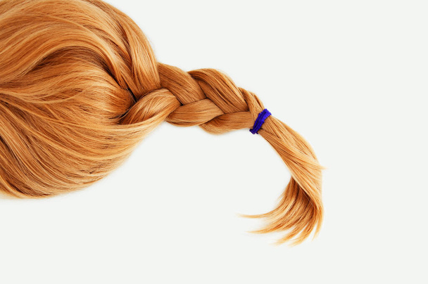 Redhead blond wig hair braided braid. White background. - Фото, изображение