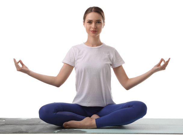 Beautiful young woman meditating on white background - Foto, Imagem