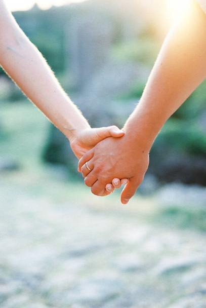 Man hand holds woman hand. Close-up - Photo, Image