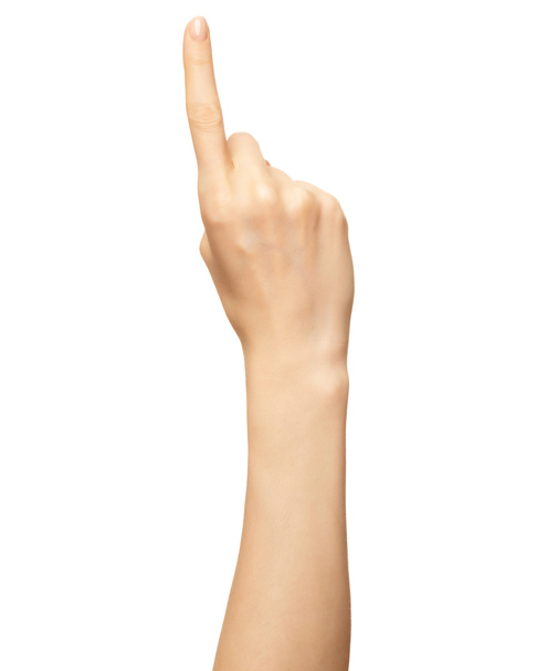 A mão feminina mostra o dedo número um isolado no branco. Dedo indicador para contar gestos, enumeração - Foto, Imagem