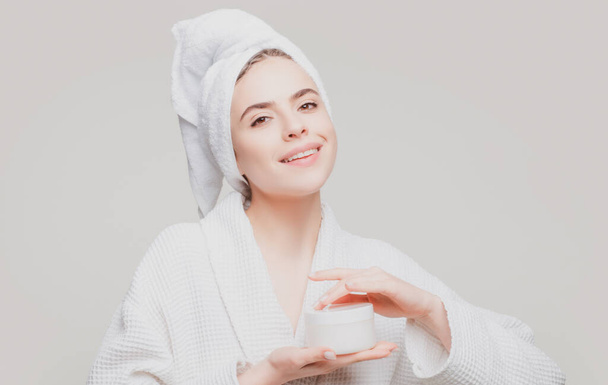Beautiful young woman smiling after face treatment. Happy beauty girl excited after spa treatment isolated on background with copy space. - Foto, Bild