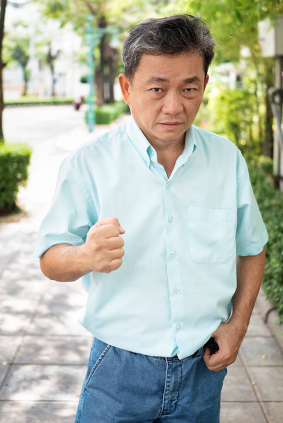 angry old senior man clenching aggressive fist - Foto, Bild
