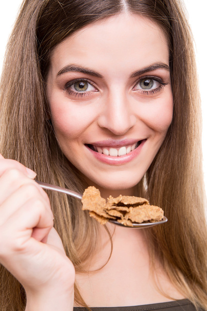 Woman eating cereals - Photo, image