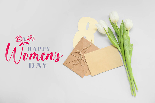 Schöne Grußkarte zum Internationalen Frauentag mit Umschlägen und Tulpenblumen - Foto, Bild