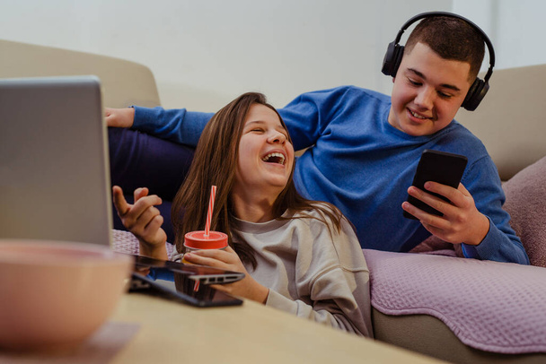 Two teenagers having fun at home. - Fotó, kép