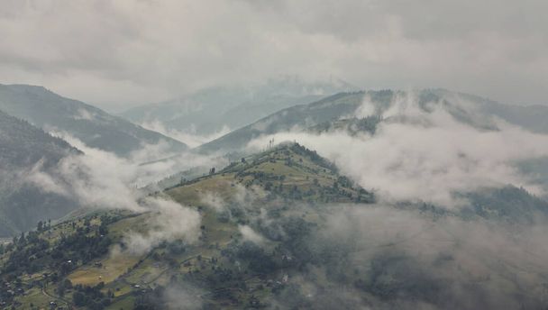 Majestic view on beautiful fog mountains in mist landscape. Dramatic unusual scene. Travel background. Exploring beauty world. Carpathian mountains. Ukraine. Europe. - Foto, imagen