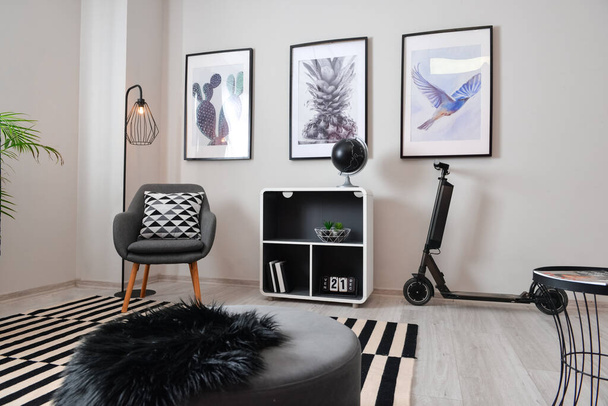 Stylish interior of minimalist room with electric scooter - Foto, imagen