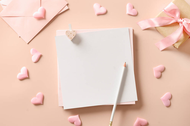 Valentines day mock up for letter with empty blank and pink hearts, gift. Greeting card - 写真・画像